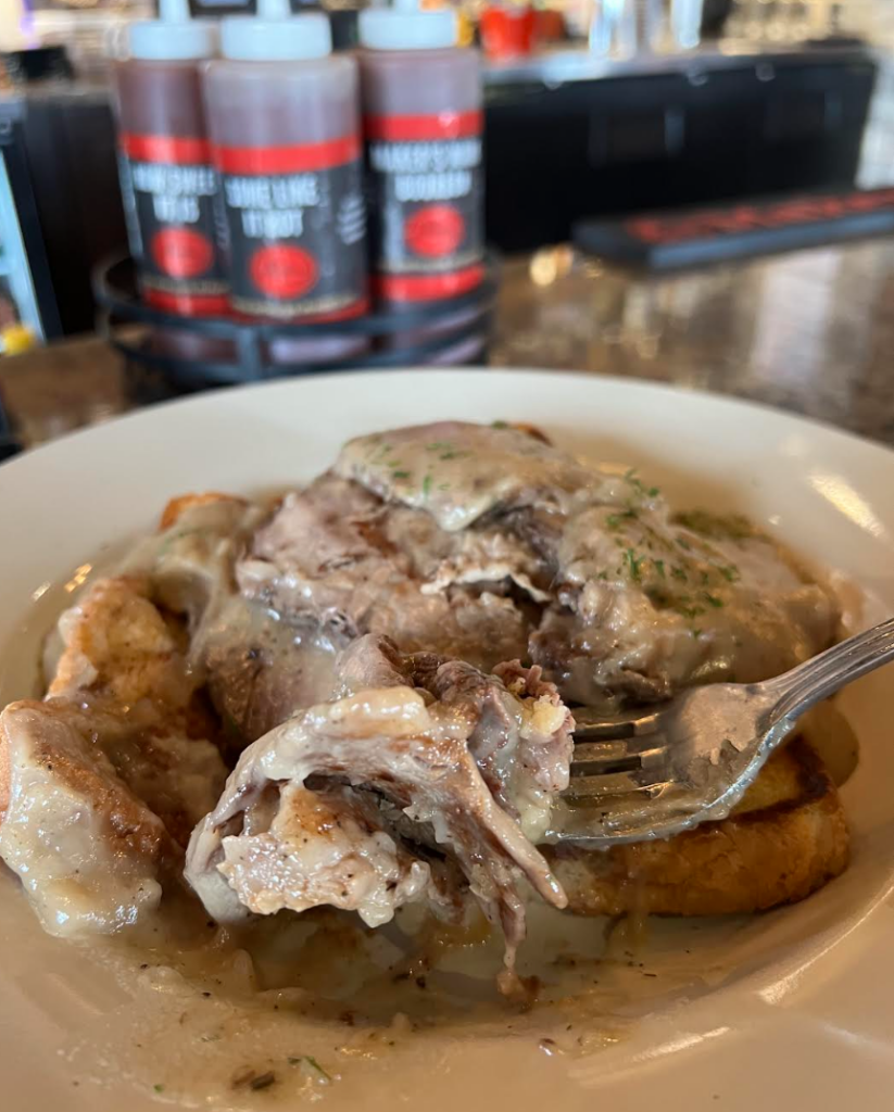 open-faced prime rib sandwich with mashed potatoes and gravy
